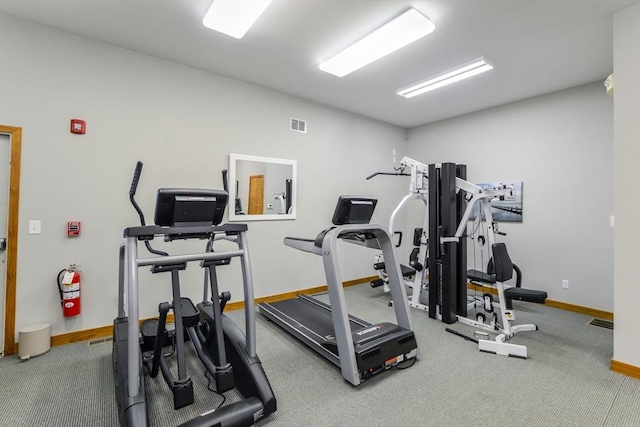 workout area with baseboards, carpet floors, and visible vents
