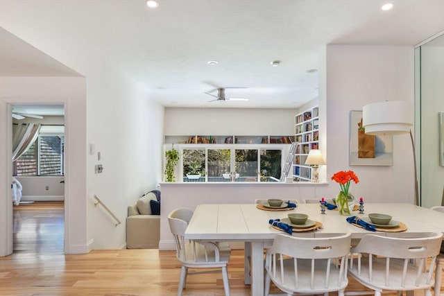 dining room featuring baseboards, ceiling fan, recessed lighting, and wood finished floors