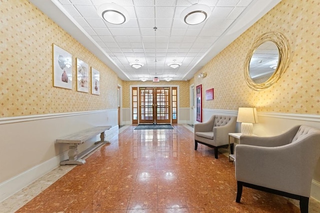 300 Allston Unit 205, Boston, MA 02135 - community lobby featuring a wainscoted wall, wallpapered walls, and a drop ceiling