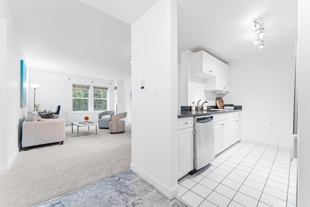 300 Allston Unit 205, Boston, MA 02135 - kitchen with stainless steel dishwasher, light carpet, white cabinets, open floor plan, and dark countertops