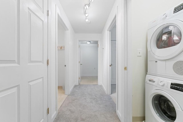 300 Allston Unit 205, Boston, MA 02135 - washroom featuring stacked washer / dryer and light carpet