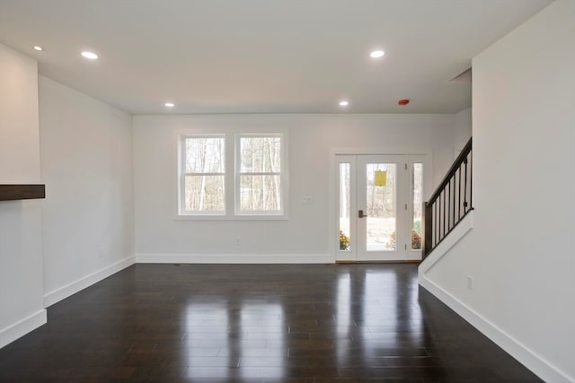 foyer entrance featuring dark wood-type flooring