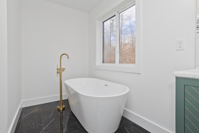 bathroom featuring vanity and a bathing tub