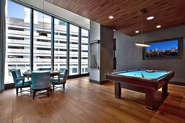 rec room with wood-type flooring, a wealth of natural light, wooden ceiling, and billiards