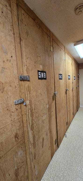 800 Bearses Way Unit 5Nb, Barnstable, MA 02601 - detailed view of wood walls, a smoke detector, and carpet floors