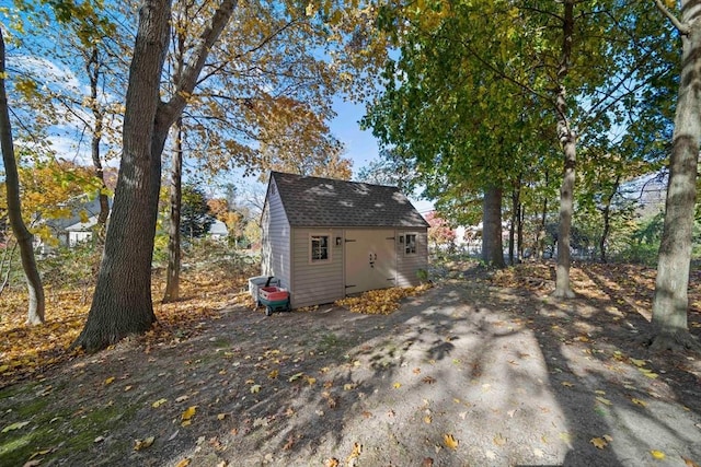 view of side of home with a storage unit