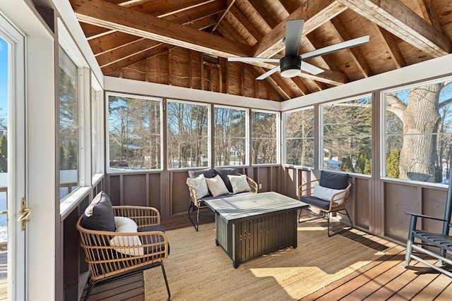 sunroom featuring vaulted ceiling, wooden ceiling, and ceiling fan