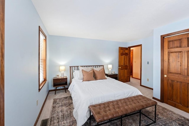 bedroom with light colored carpet