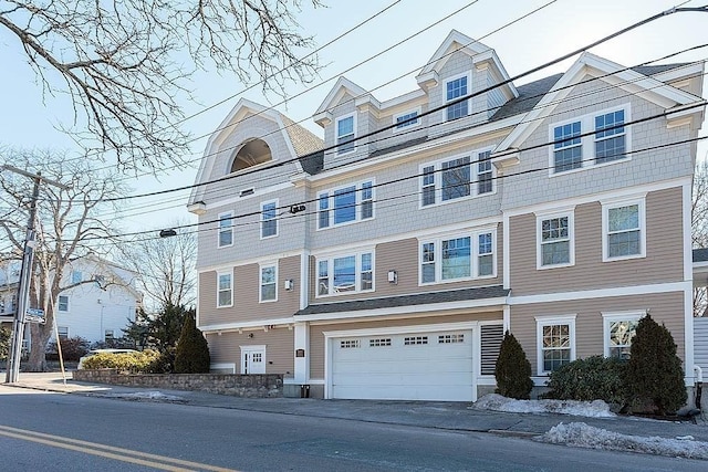 multi unit property featuring a garage