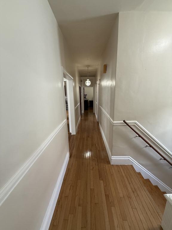 50 Proctor Ave, Revere, MA 02151 - hallway featuring wood-type flooring and baseboards