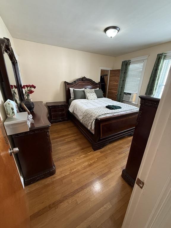 50 Proctor Ave, Revere, MA 02151 - bedroom featuring wood finished floors and cooling unit