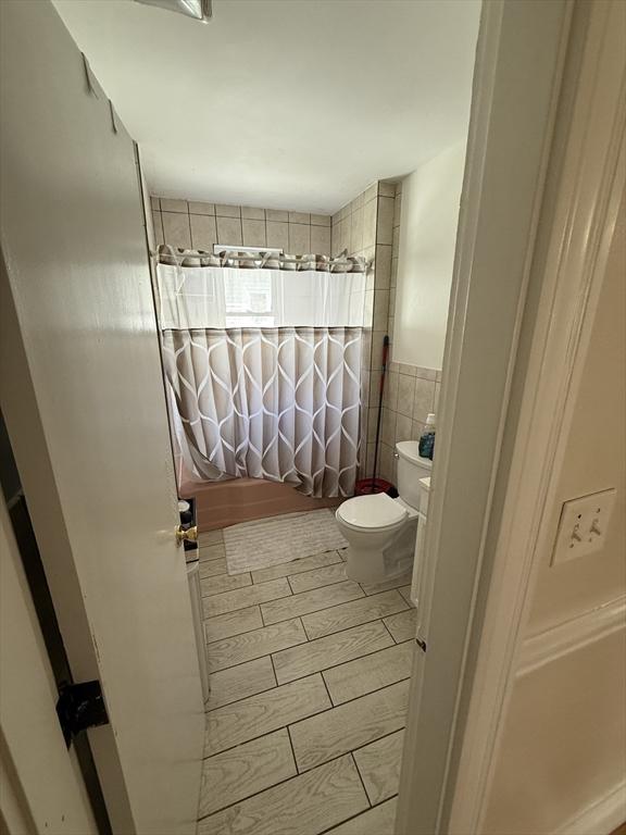 50 Proctor Ave, Revere, MA 02151 - full bath with toilet, shower / tub combo, and tile walls