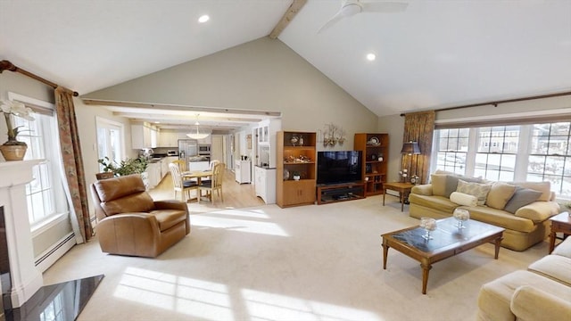 carpeted living room featuring vaulted ceiling with beams, ceiling fan, and a baseboard heating unit