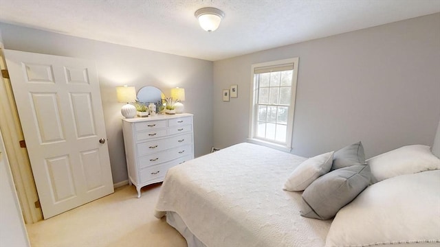 bedroom featuring light carpet