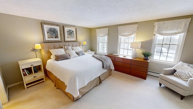 bedroom with light colored carpet and a baseboard heating unit