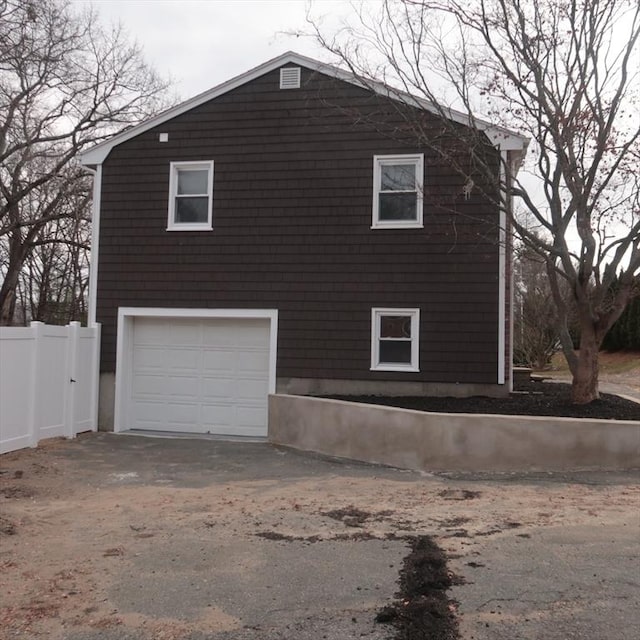 view of side of property featuring a garage