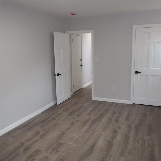 spare room featuring hardwood / wood-style flooring