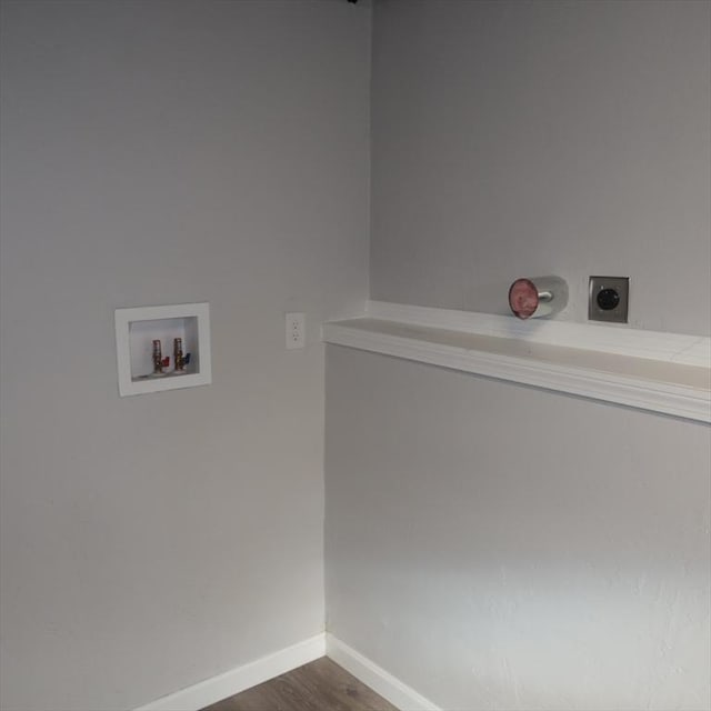 clothes washing area featuring electric dryer hookup, hookup for a washing machine, and dark hardwood / wood-style floors