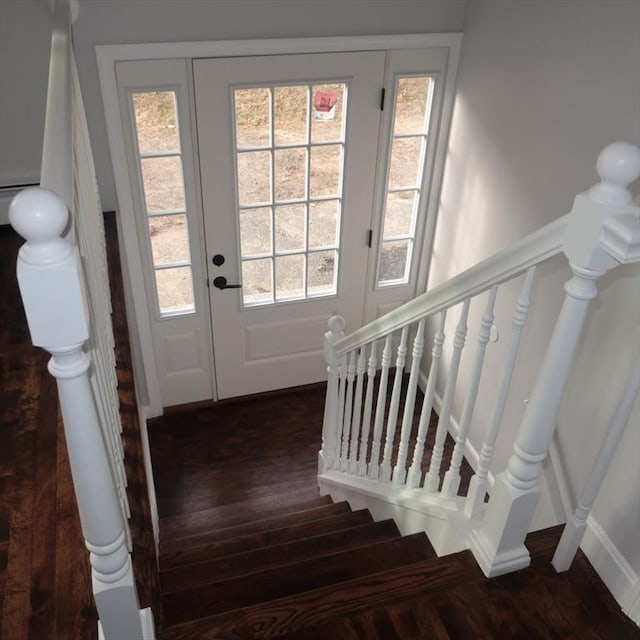 stairs featuring hardwood / wood-style flooring