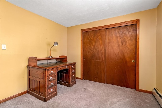 carpeted office with baseboards and a baseboard radiator
