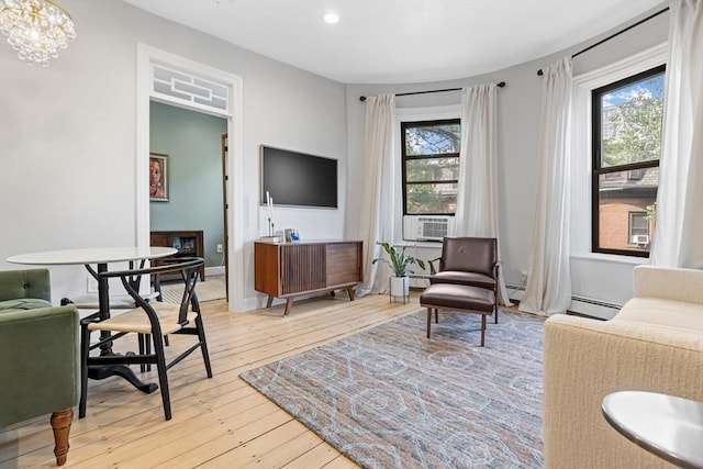81 E Brookline St Unit 3, Boston, MA 02118 - living area with light wood-style flooring, recessed lighting, baseboard heating, and a chandelier
