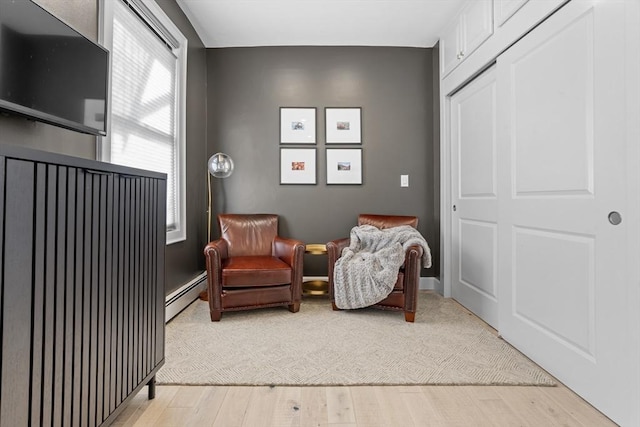 81 E Brookline St Unit 3, Boston, MA 02118 - sitting room with a baseboard heating unit and light wood finished floors