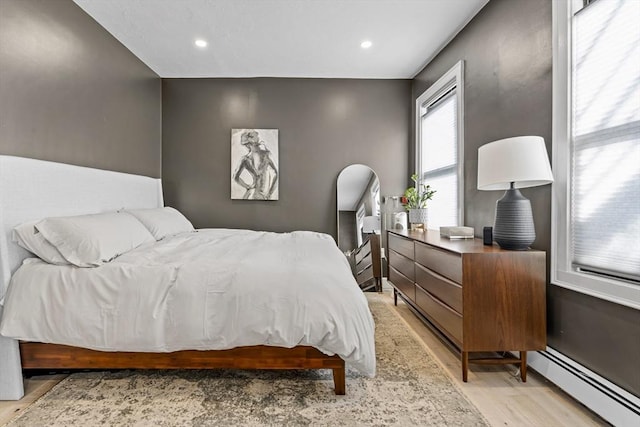 81 E Brookline St Unit 3, Boston, MA 02118 - bedroom with a baseboard radiator, light wood finished floors, and recessed lighting