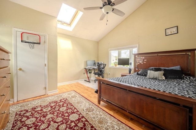 342 Townsend Rd, Groton, MA 01450 - bedroom featuring a skylight, light wood finished floors, high vaulted ceiling, baseboards, and a ceiling fan