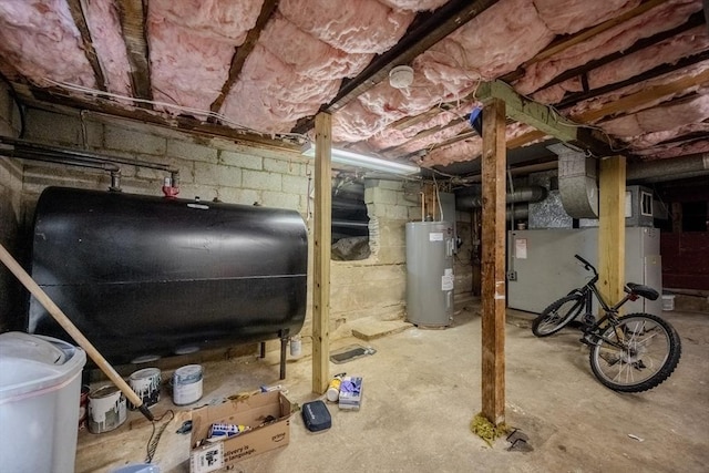 342 Townsend Rd, Groton, MA 01450 - unfinished basement featuring oil tank, water heater, and heating unit