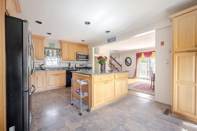 342 Townsend Rd, Groton, MA 01450 - kitchen featuring appliances with stainless steel finishes, light brown cabinets, a center island, backsplash, and recessed lighting