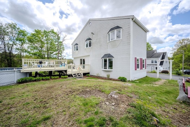 342 Townsend Rd, Groton, MA 01450 - rear view of house with a deck and a lawn