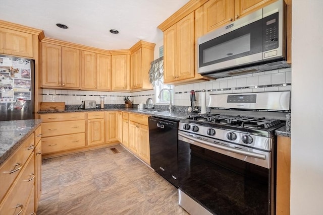 342 Townsend Rd, Groton, MA 01450 - kitchen with stainless steel appliances, light brown cabinetry, a sink, and dark stone counters