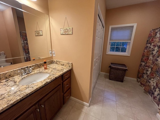 bathroom featuring tile patterned floors and vanity