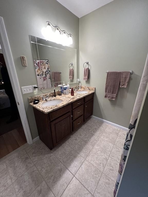 bathroom featuring vanity and tile patterned flooring