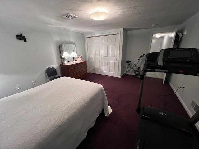 carpeted bedroom with a closet