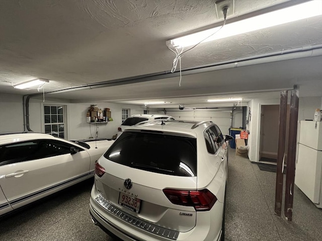 garage with white refrigerator