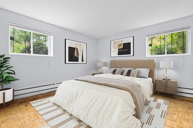 18 Pond St Unit 2, Boston, MA 02130 - bedroom featuring a baseboard heating unit, multiple windows, and baseboard heating