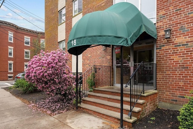 18 Pond St Unit 2, Boston, MA 02130 - view of exterior entry featuring brick siding