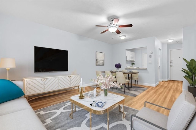 18 Pond St Unit 2, Boston, MA 02130 - living area with light wood-style flooring, ceiling fan, and baseboards