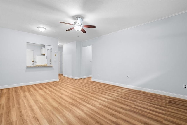 18 Pond St Unit 2, Boston, MA 02130 - unfurnished living room with ceiling fan, baseboards, and light wood-style flooring