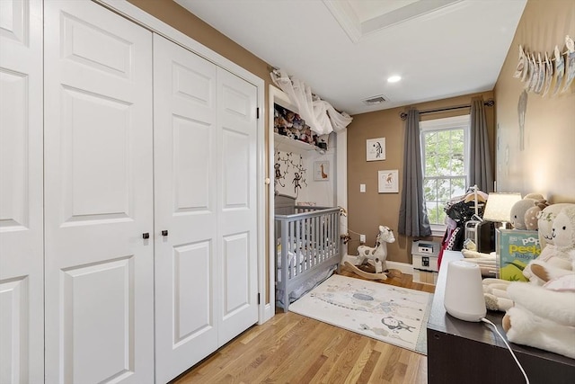 4 Elizabeth Rd, Hudson, MA 01749 - bedroom featuring a closet, light wood finished floors, recessed lighting, baseboards, and a crib