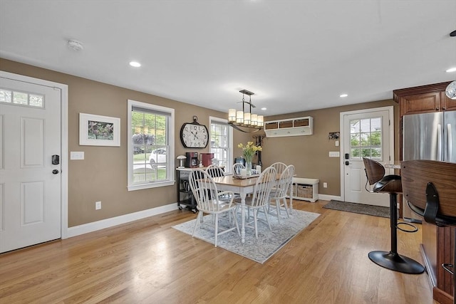 4 Elizabeth Rd, Hudson, MA 01749 - dining space with baseboards, a wall mounted AC, light wood-style flooring, a chandelier, and recessed lighting