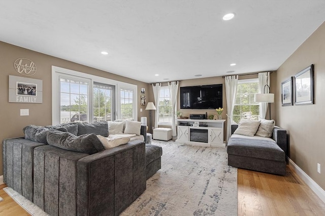 4 Elizabeth Rd, Hudson, MA 01749 - living room featuring light wood-type flooring, baseboards, recessed lighting, and a fireplace