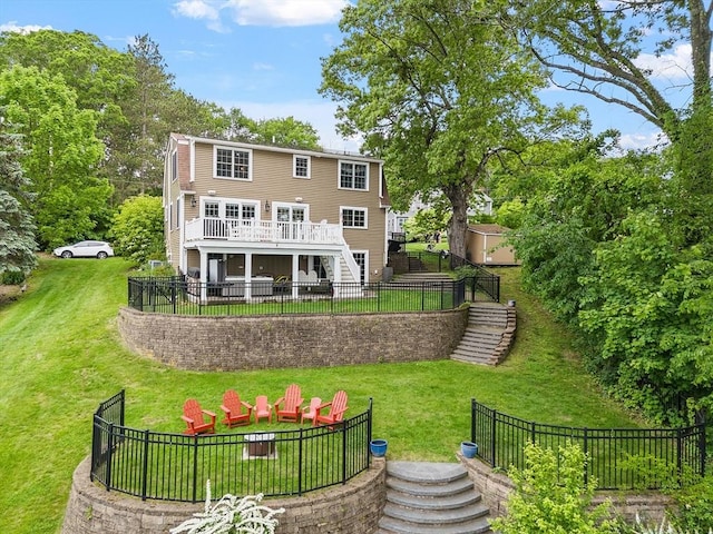 4 Elizabeth Rd, Hudson, MA 01749 - back of property with stairs, a fire pit, a wooden deck, and a patio area