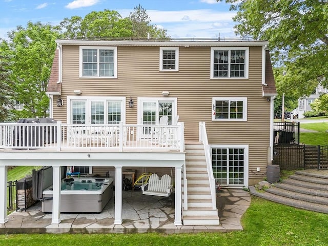 4 Elizabeth Rd, Hudson, MA 01749 - back of property with stairway, a patio, a hot tub, and a deck