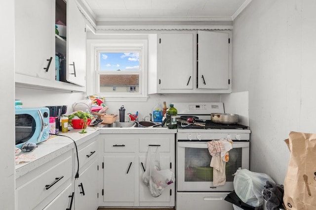 135 Snell, Fall River, MA 02721 - kitchen featuring gas range gas stove, crown molding, white cabinets, and light countertops