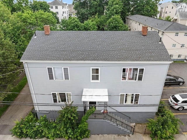 135 Snell, Fall River, MA 02721 - back of house featuring a chimney and a shingled roof