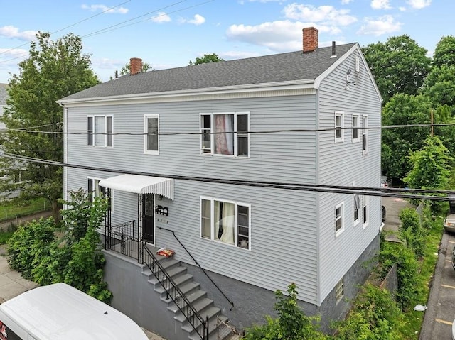 135 Snell, Fall River, MA 02721 - view of front of home featuring a chimney and a shingled roof