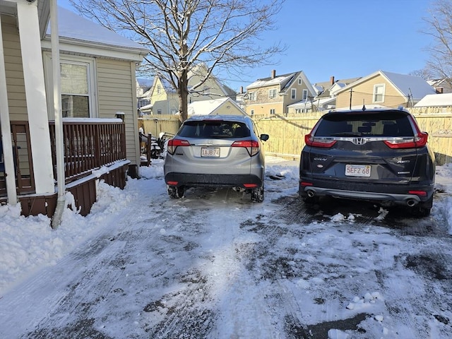 view of snow covered parking