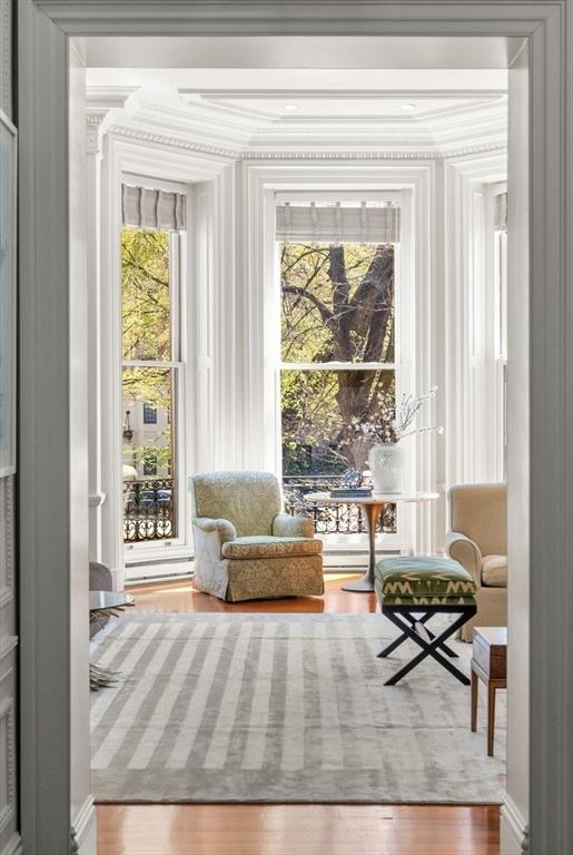 interior space featuring ornamental molding and wood finished floors